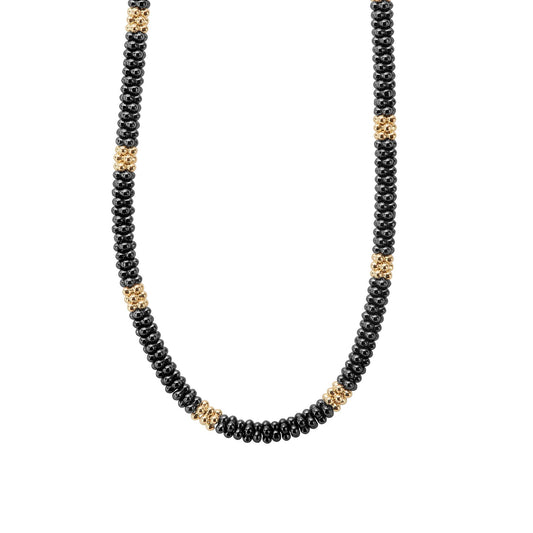 A refined Lignora Black Caviar necklace featuring twelve 18K gold small stations interspersed with black ceramic Caviar beads on a sterling silver rope, around 5 mm in width, 16″‑18″ length, secured with an 18K gold lobster clasp