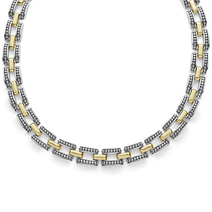 A two-tone Lignora High Bar Caviar link necklace featuring alternating sterling silver and 18K gold Caviar‑beaded links in a 22 mm width, secured by a double-button box clasp an elegant statement piece mixing silver and gold tones